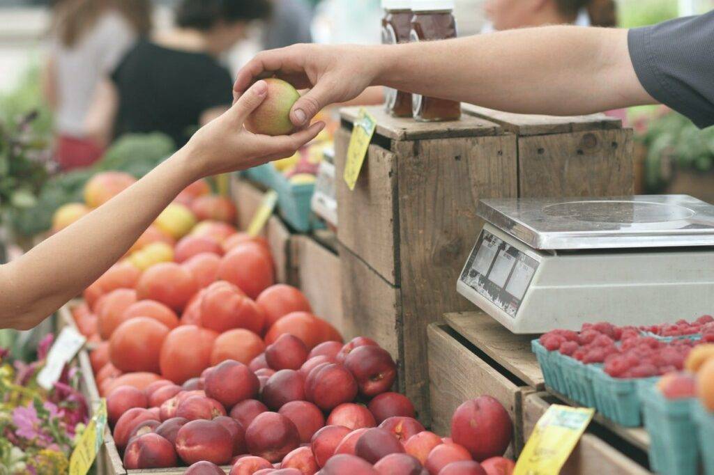 Handing over an apple to someone