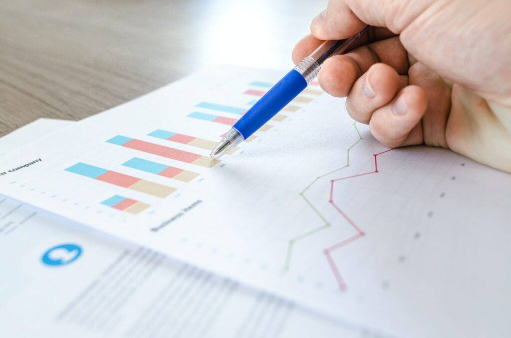 Pen pointing at charts