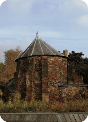 Brick building with grass in the foreground