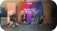 Four people sitting in front of a BBC share your story panel