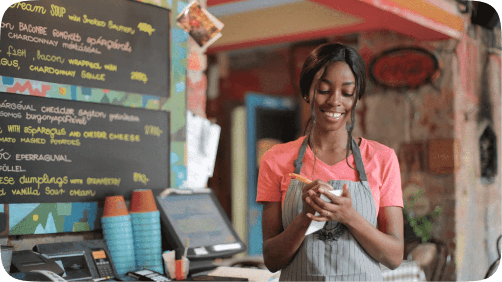 Woman writing down orders at a café