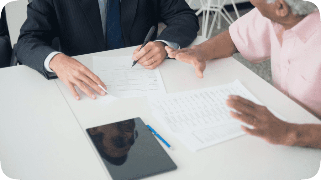 Two people sitting at a table discussing work